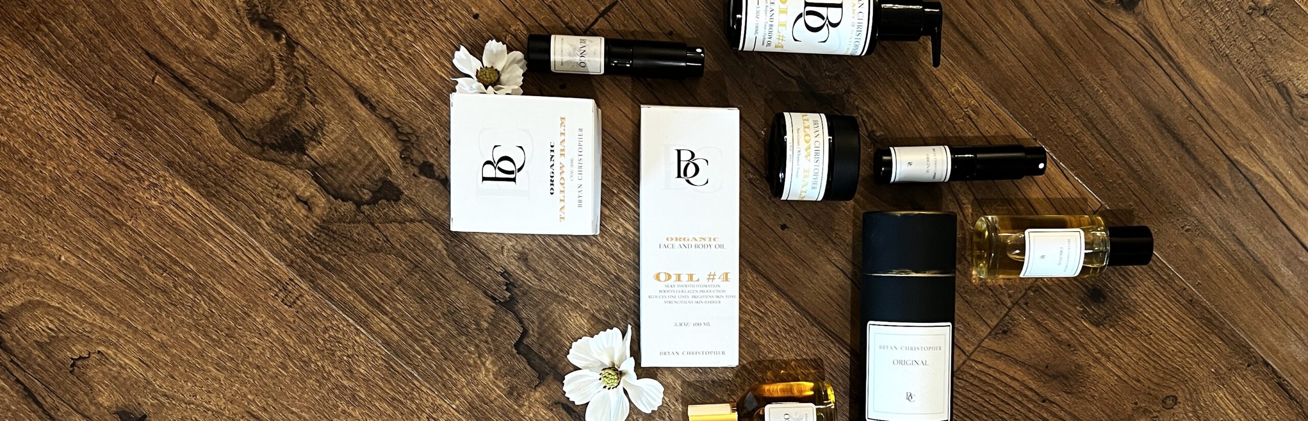 Skincare bottles and jars flat lay on wood